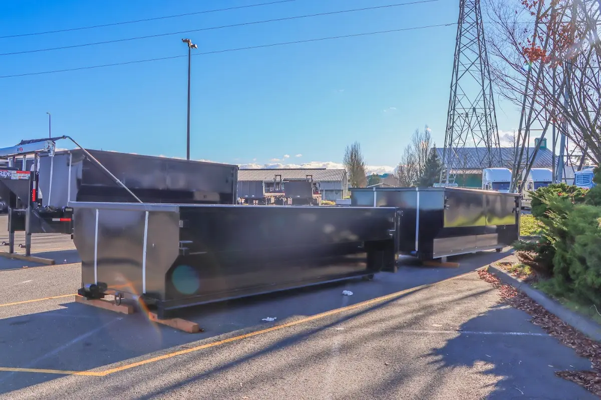 Roll-off dumpster ready for waste disposal at job site for 2 Yard Dumpster Rental in Pueblo West